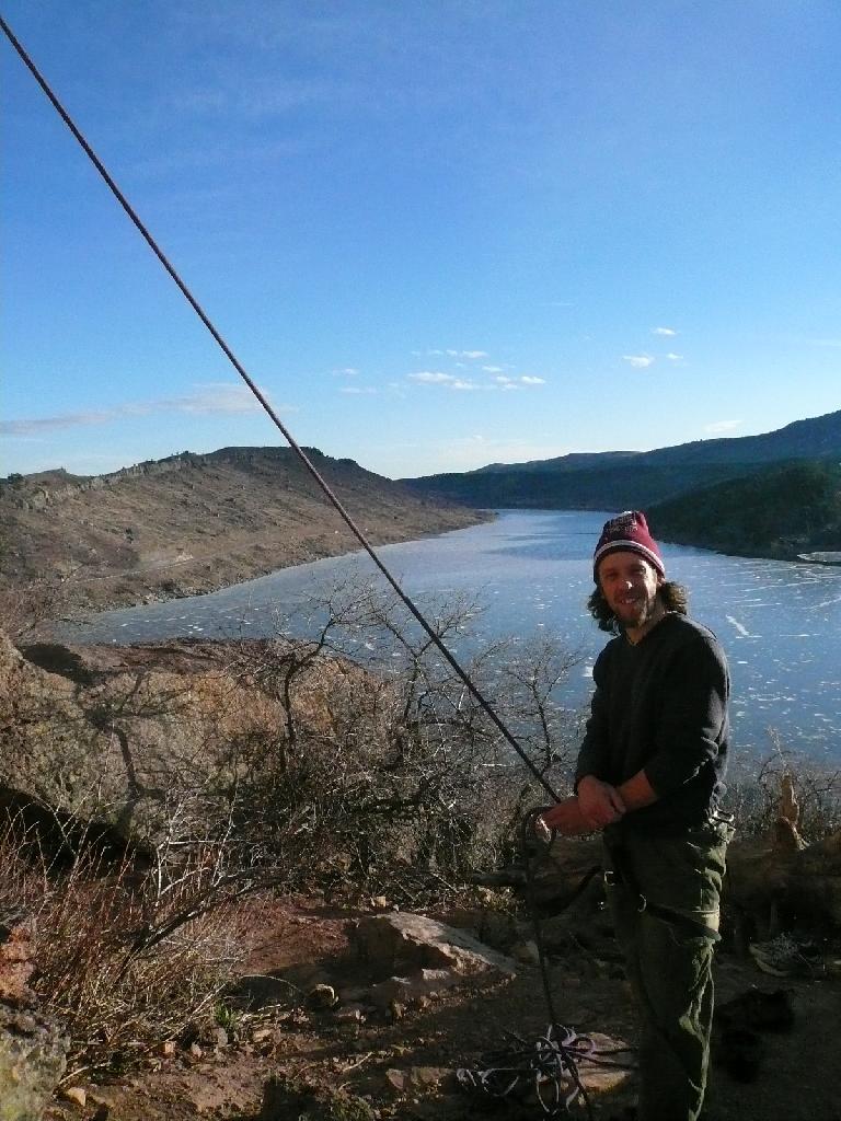 Nick belaying, with a great view of the Horsetooth Reservoir behind him.