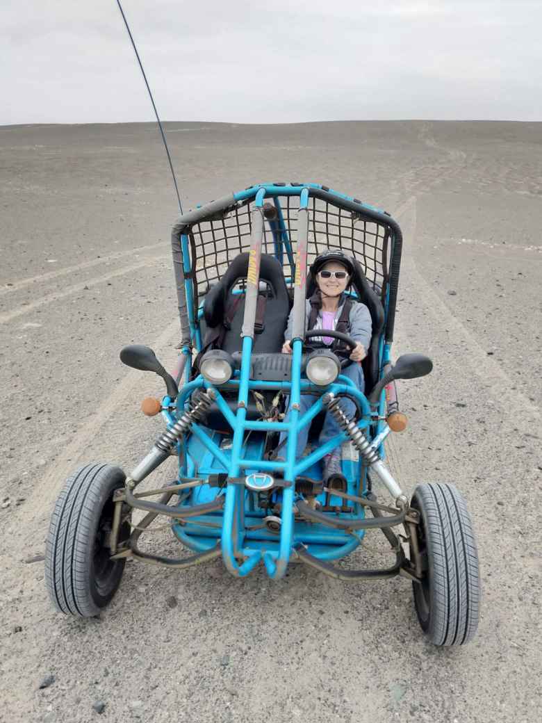 Mel and the dune buggy we rented in Paracas.