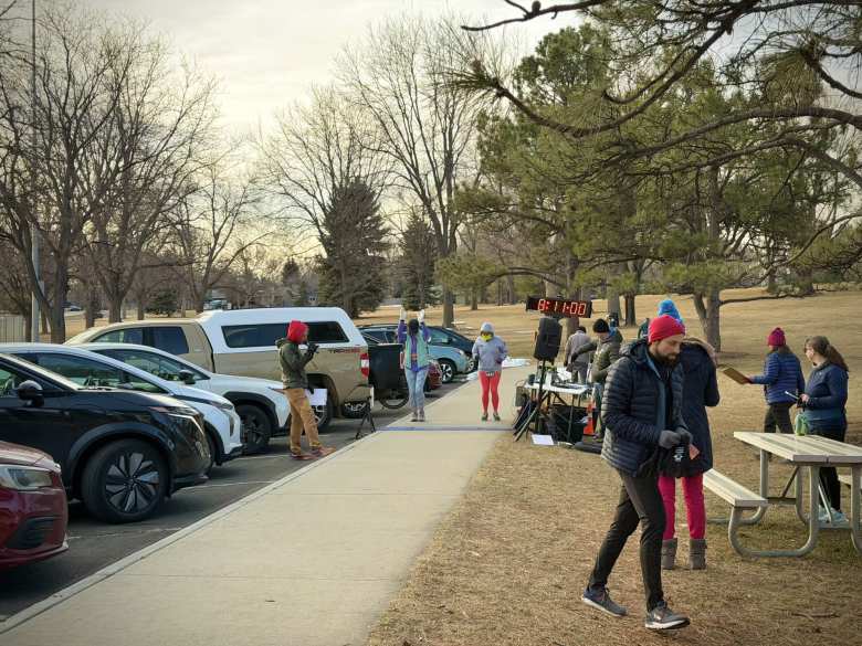 Runners lining up for their start at Fort Collins Running Club's Edora Park 8K Tortoise & Hare race.