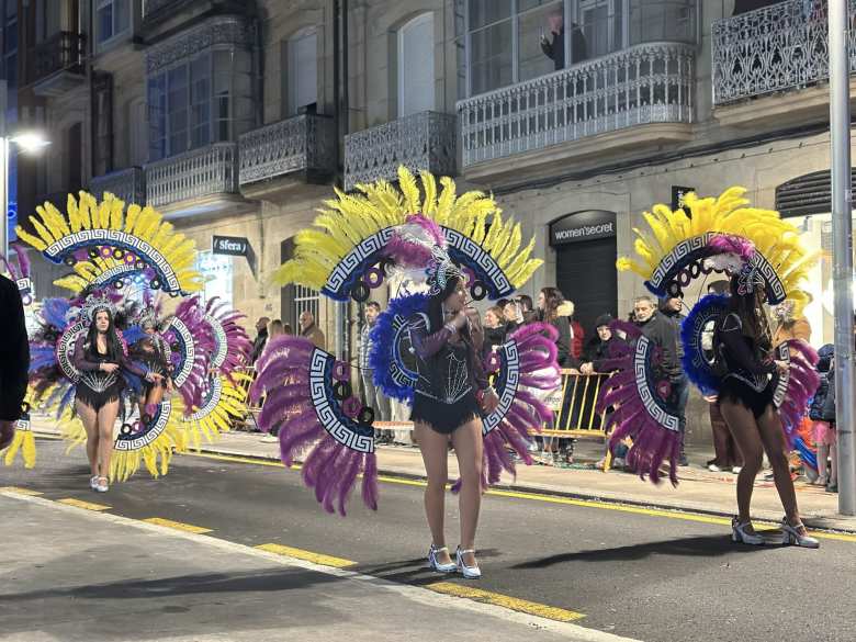 More schoolgirls in elaborate feathered costumes.