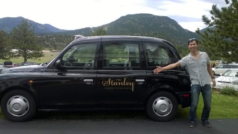 Felix Wong with the Stanley Hotel London Taxi (black TX4 Hackney Carriage).
