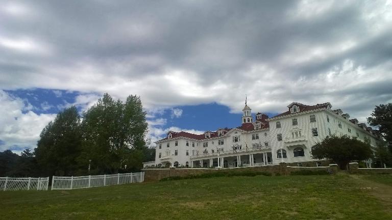 Stanley hotel with clouds above.