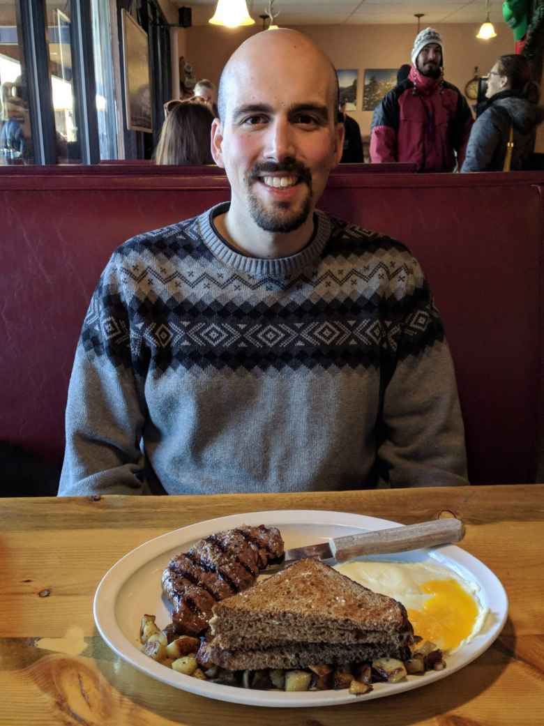 Manuel with a steak breakfast entree at the Notchtop Bakery & Diner in Estes Park.