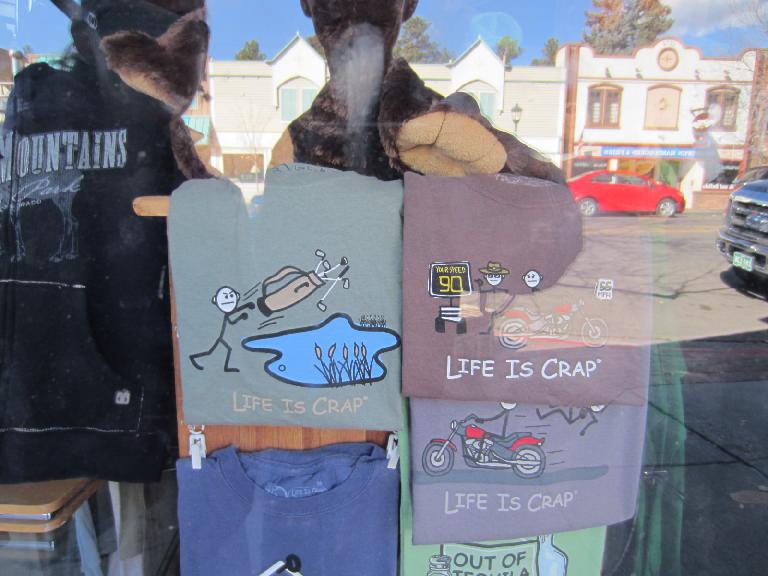 "Life is crap"---a play on the "life is good" t-shirts.