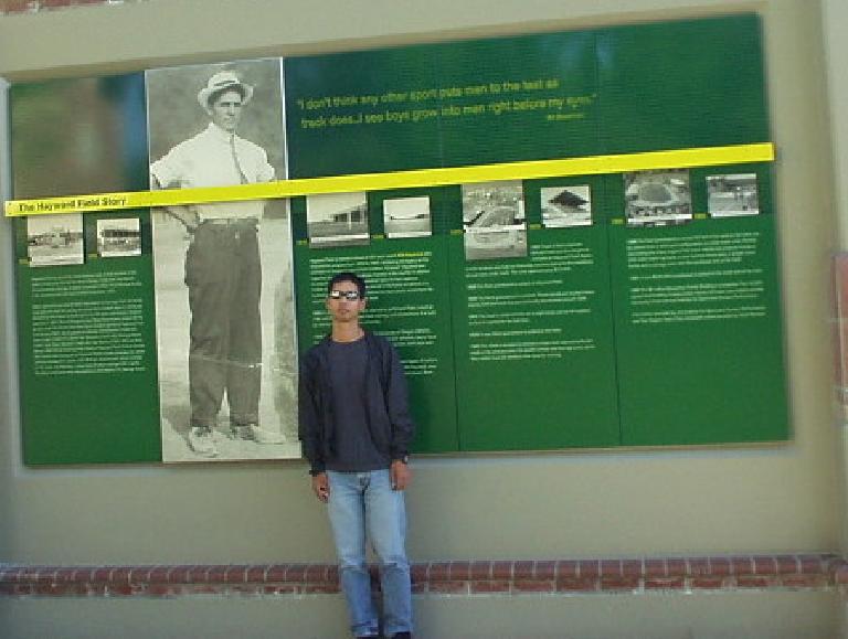 In 2004, the University of Oregon posted stories of Hayward Field and the legends it spawned.  Here is Felix Wong standing by a photo of Bill Bowerman, co-founder of Nike.  Legend has it he made the soles of the first Nike shoes with his wife's waffle iron.