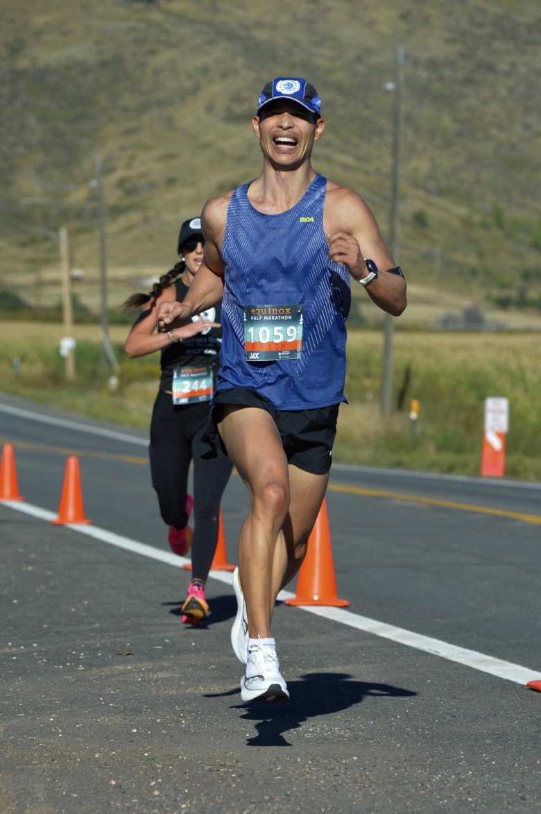 Felix straining while passing a woman in the final 200 meters