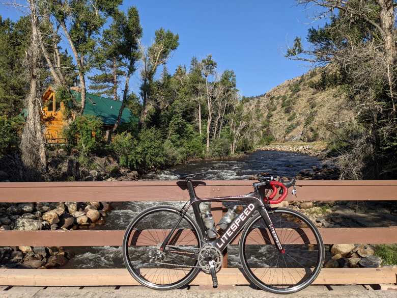 My black Litespeed Archon C2 in front of the Poudre River.