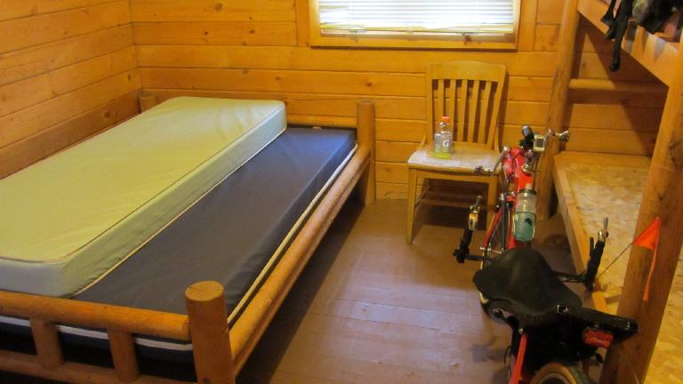 The KOA cabin I made an emergency stay at did not have blankets, so I took the mattresses from the bunks and slept under both of them for the night. (Only one shown in photo.)