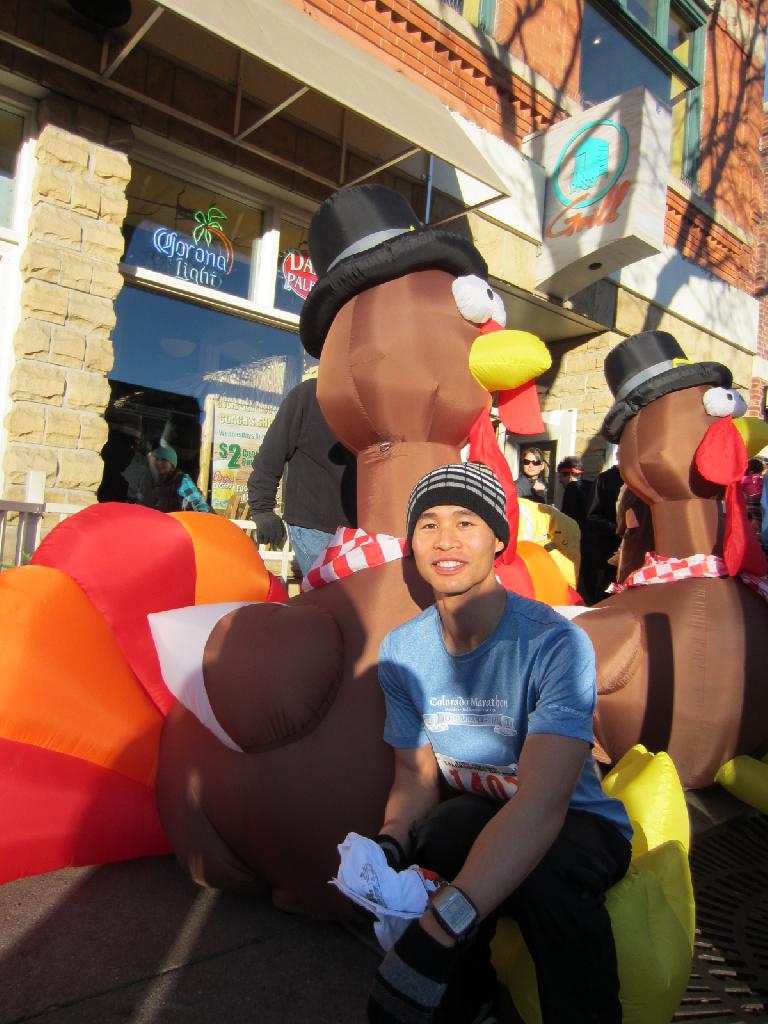 Felix Wong with the traditional blowup turkeys.