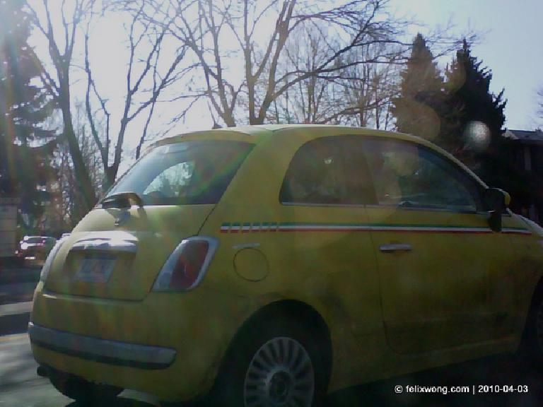 right rear three-quarter of a yellow FIAT 500 prototype