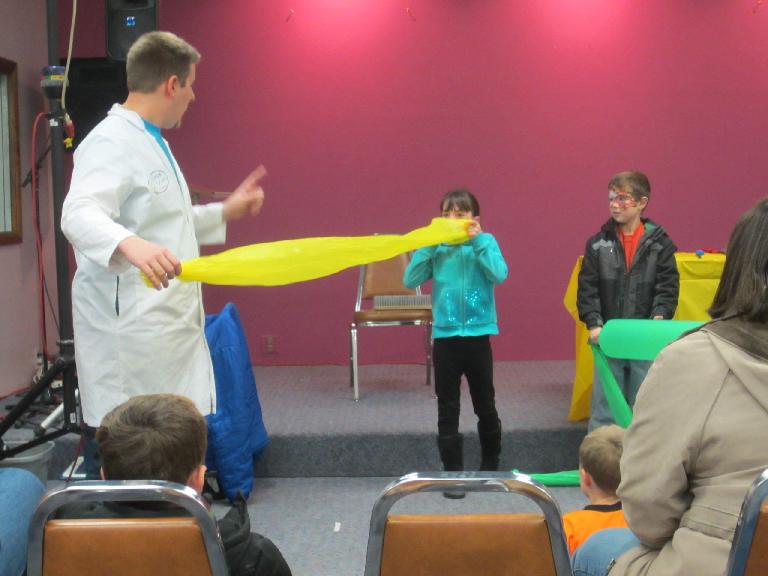 Some kids getting a lesson on the Bernoulli principle at the Science Matters Show.