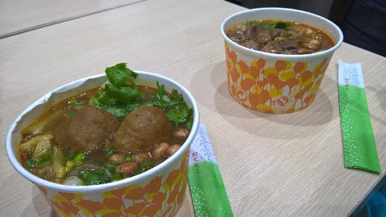 Paper bowls of meatball soup served up in a small restaurant off the Shangxiajiu Pedestrian Street in Guangzhou, China.