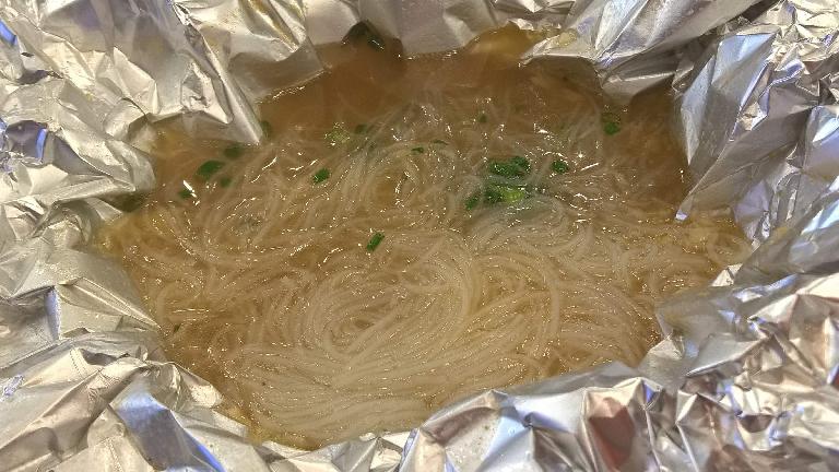 A noodle soup cooked inside aluminum foil at a food court in Guangzhou.