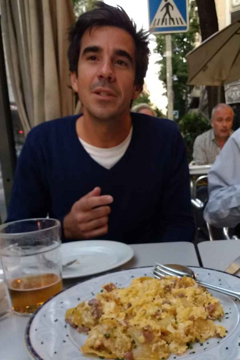 My friend Javi with huesos rotos (broken eggs) in Madrid.