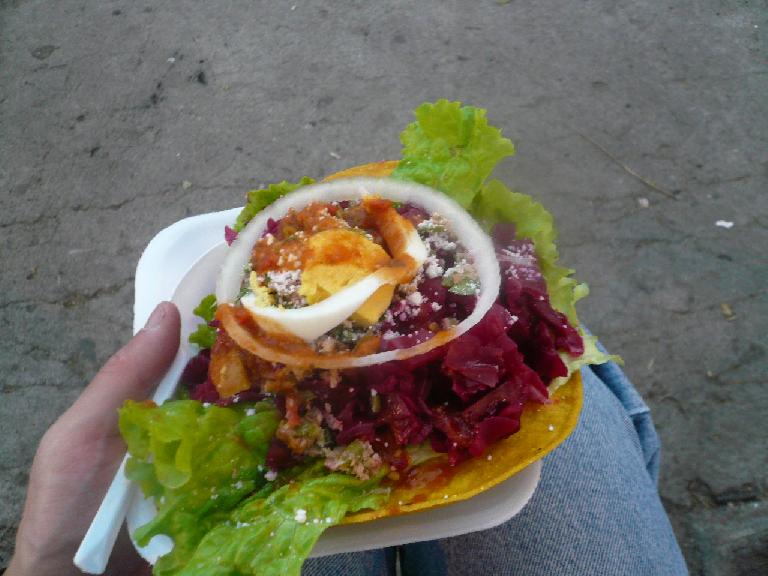 This crispy tortilla with lettuce, radishes, onion and cheese was delicious. It was Q7 (USD$0.89) in Antigua, Guatemala. I'm not sure what the actual name of it is. (December 26, 2010) This crispy tortilla with lettuce, radishes, onion and cheese was delicious. It was Q7 (USD$0.89) in Antigua, Guatemala. I'm not sure what the actual name of it is. (December 26, 2010)