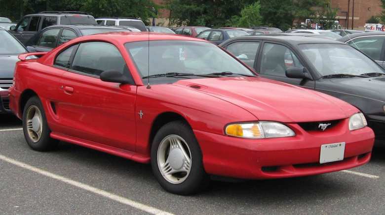 A red 1994 Ford Mustang Coupe.