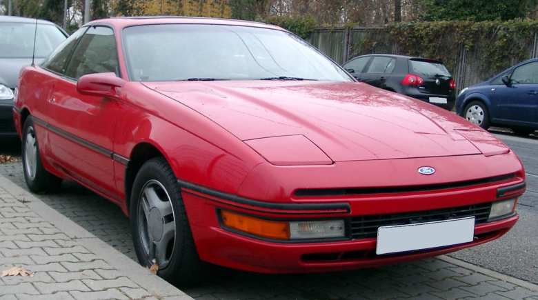 A red 1990 Ford Probe.