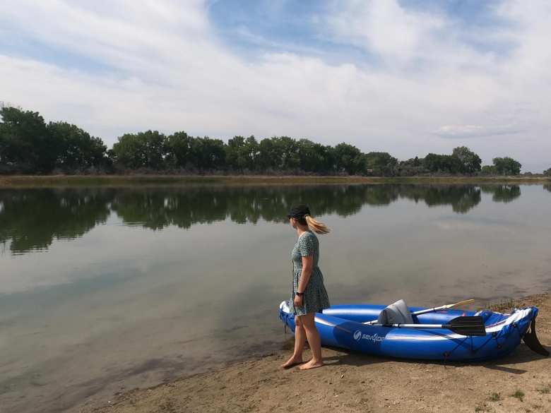 Andrea with a blue Sevylor kayak on Richards Lake.