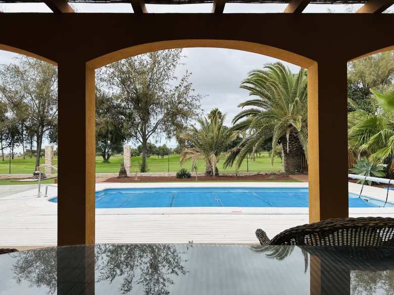 The pool at Chris' villa, with the Fuerteventura Golf Club behind.