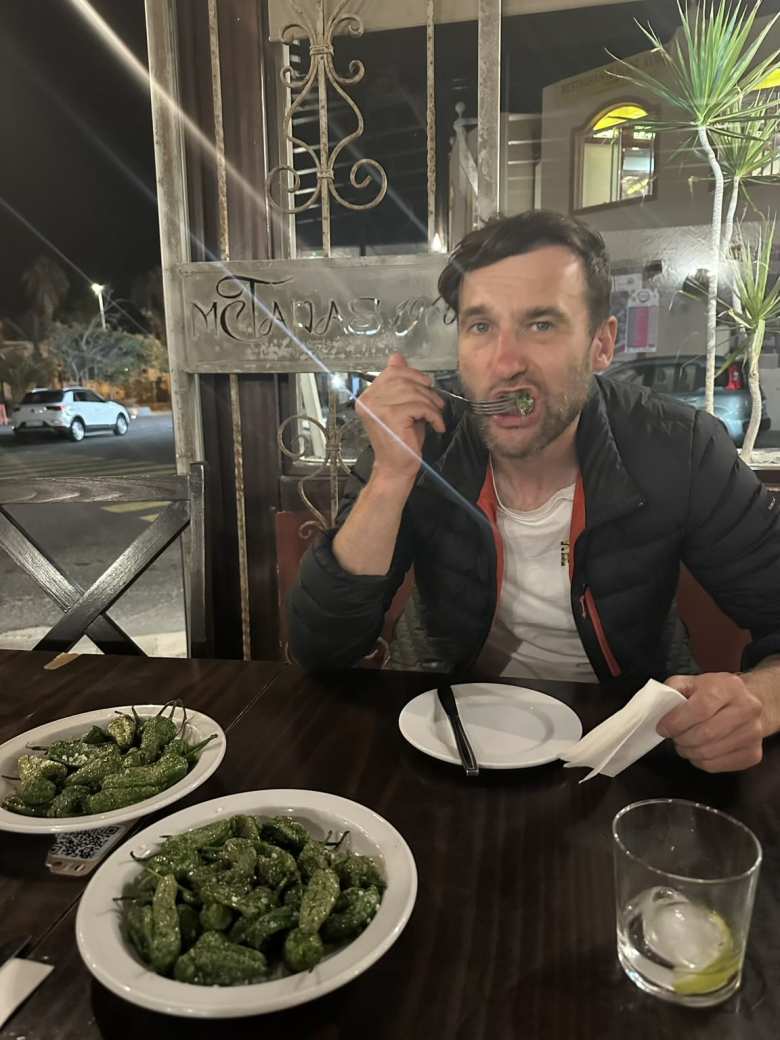 Chris enjoying some delicious pimientos de Padrón during my last night in Fuerteventura.