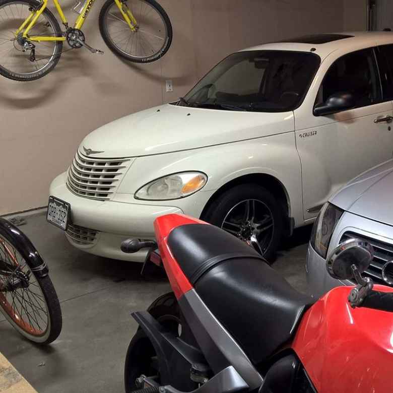 yellow 1996 Cannondale F700, vanilla 2005 Chrysler PT Cruiser, silver 2001 Audi TT Roadster Quattro, red 2003 Buell Blast, inside garage