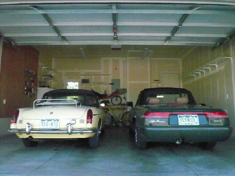 [Before] While the garage at least was 95% drywalled, most drywall seams were untaped.  Also note ugly shelving.