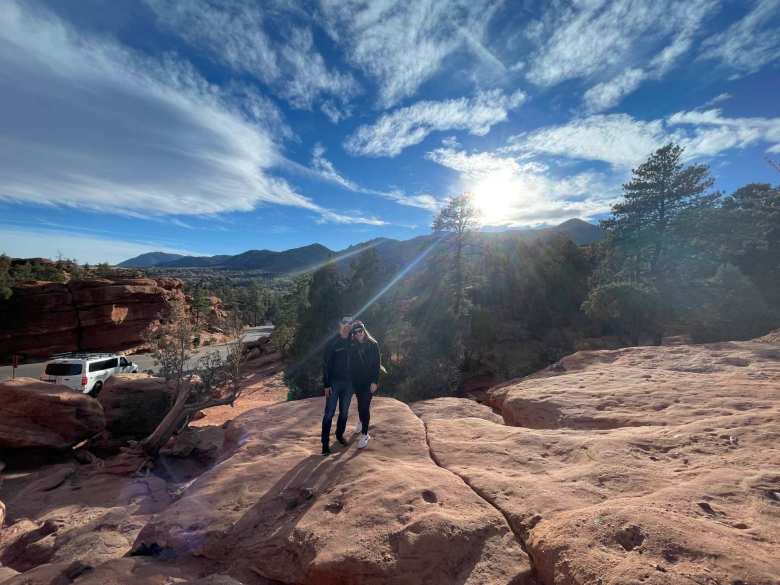 Felix and Andrea mere steps away from Balanced Rock with Manitou Springs in the background.