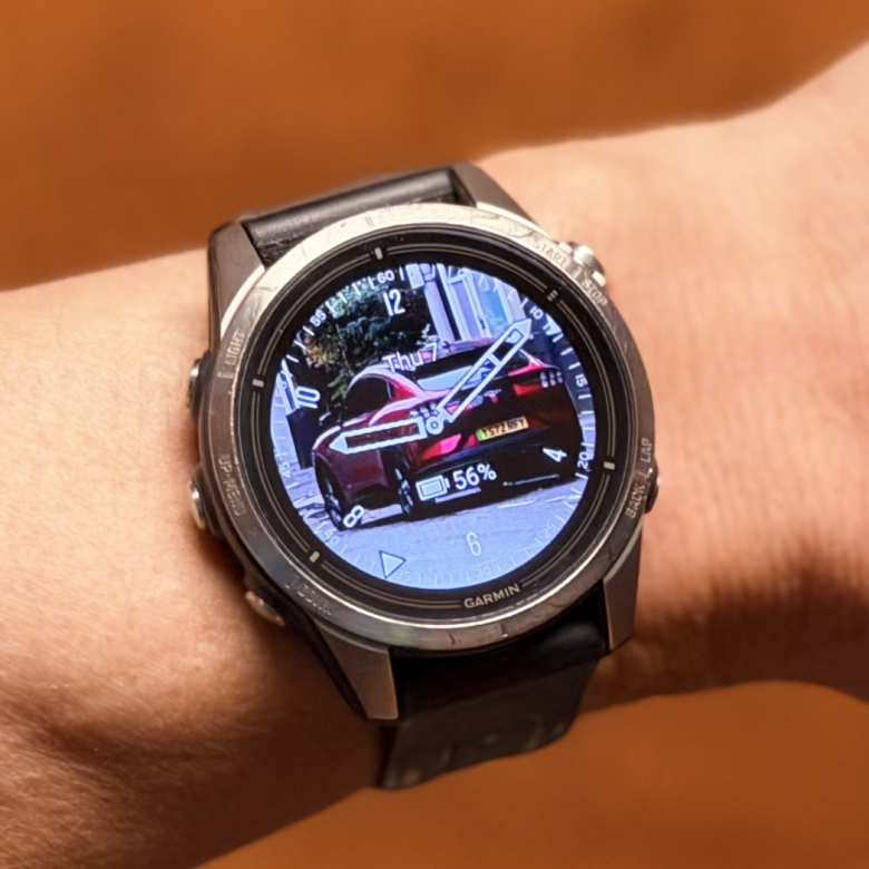 The Face It® watch face on my Garmin epix Pro (Gen 2) watch, using a photo I took in London of a red British brother of my Mustang Mach-E.
