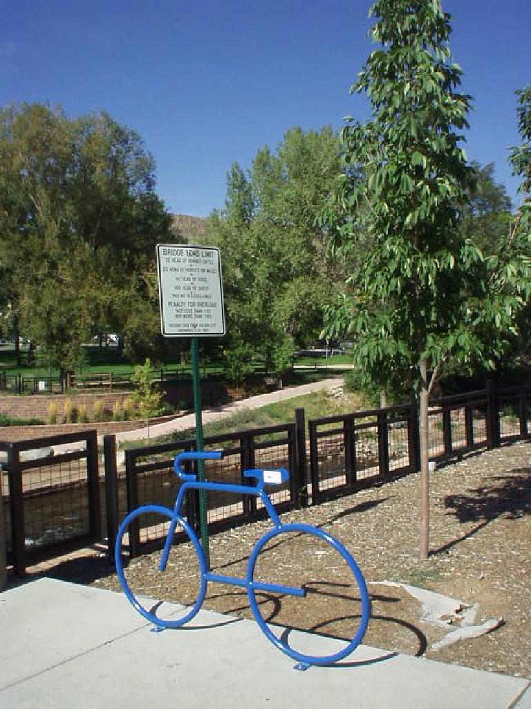 Another bike rack shaped as a bicycle in front of a park.  I love these!