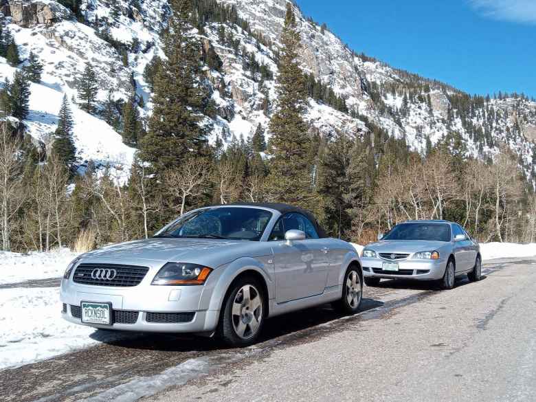 Silver Audi TT Roadster Quattro and Acura CL a mile west of Poudre Falls in the Poudre Canyon (CO-14).