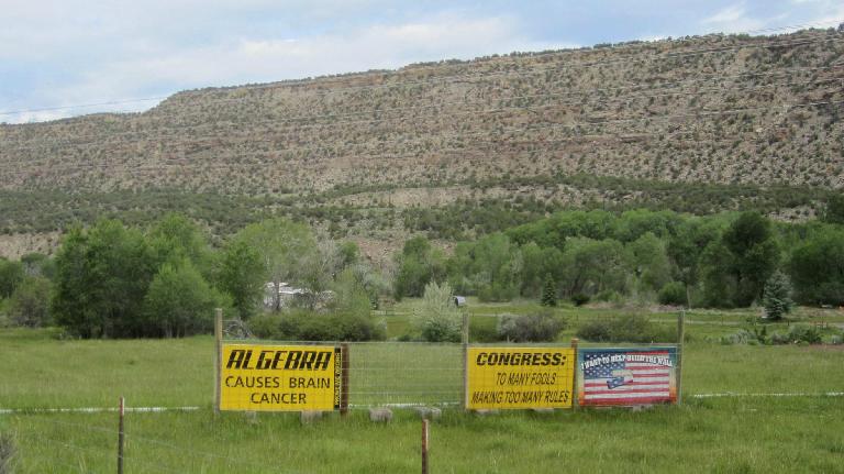 [Mile 51, 8:08 a.m.] Some signs in Molina, a rural area outside of Mesa, Colorado.