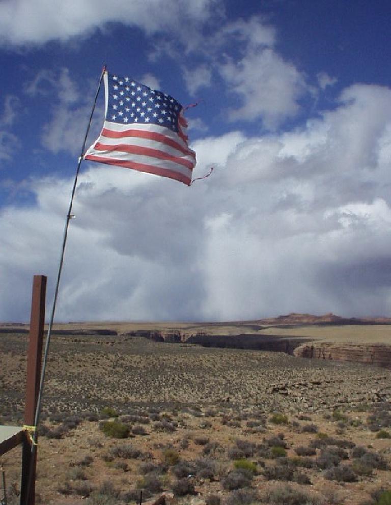 An American flag flies high above the canyon that Teddy Roosevelt felt every American must see before he dies.