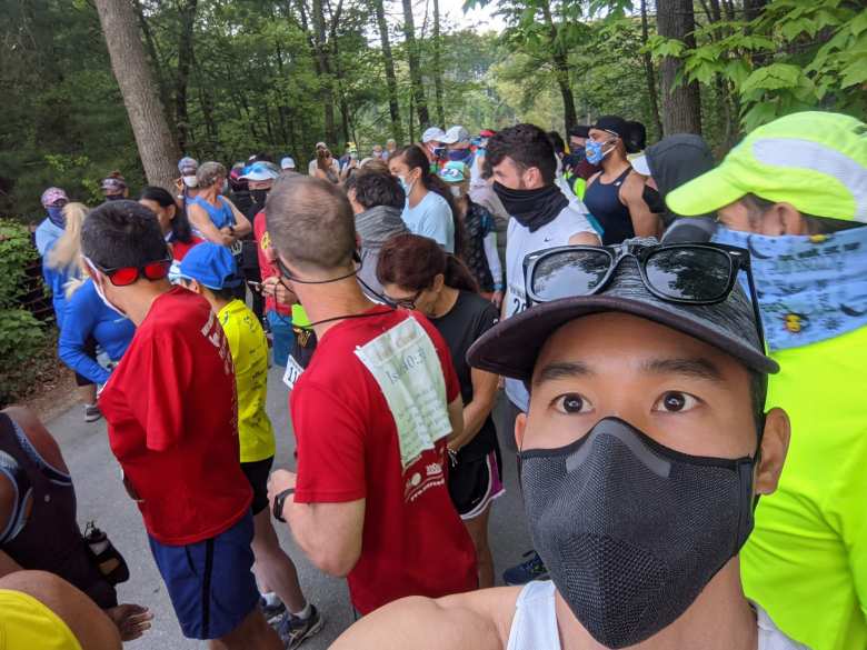 runners wearing facemasks at the start of the Granite State Marathon