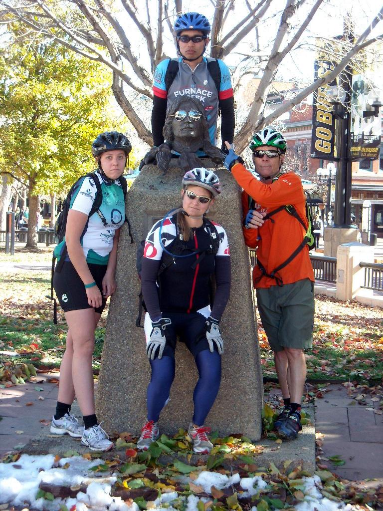 Our team posing with a serious-looking statue.