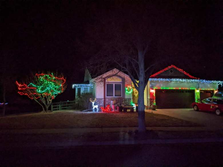 A home in the Hearthfire subdivision with red and green Christmas lights.