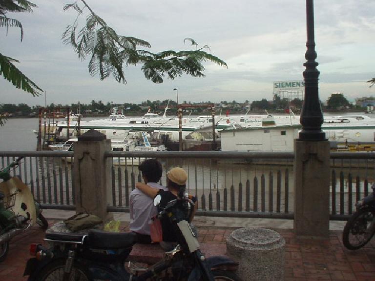 Two lovebirds enjoy the view by the Saigon River.
