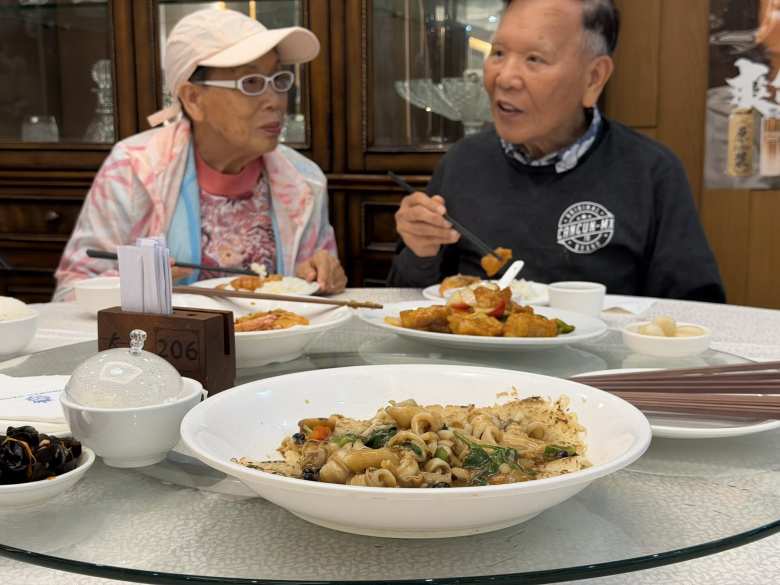 My aunt and dad share a warm moment and a seafood dinner at Tsing Shan Wan Seafood Restaurant.
