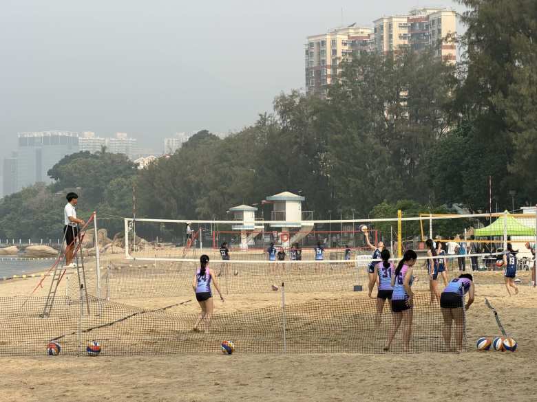Some girls volleyball team practicing on the Golden Beach.