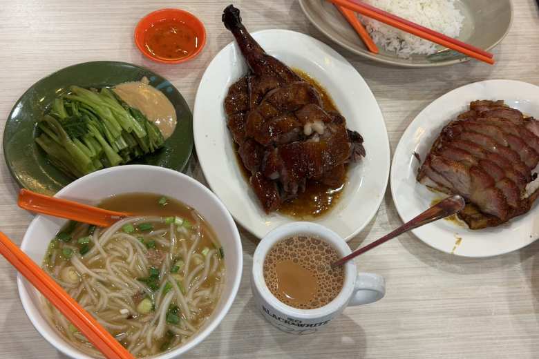 Our dinner at Yat Lok restaurant (established 1957) in Hong Kong consisted of roast goose, char siu, rice, noodle soup, Hong Kong milk tea, and choy sum (Chinese flowering cabbage).