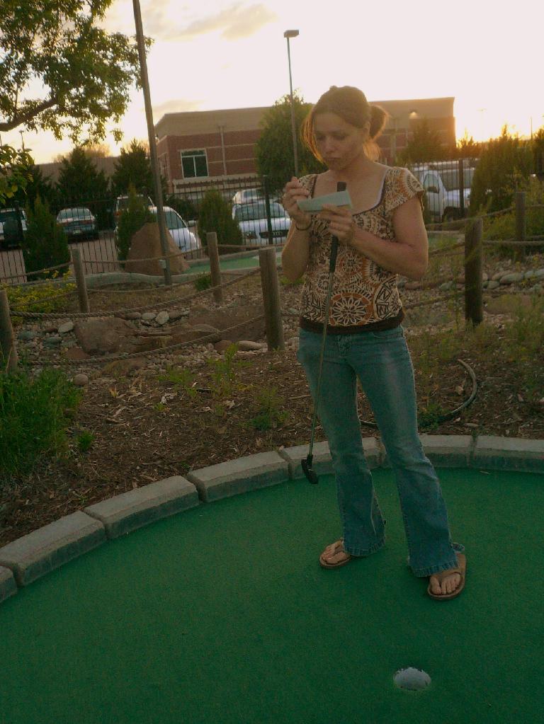 Leah tabulating how badly I beat her in mini-golf later that evening.