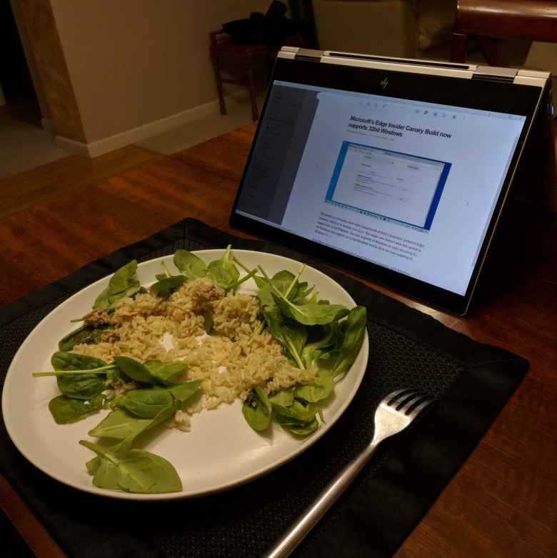 silver 2018 HP Spectre x360 in tent mode while eating dinner