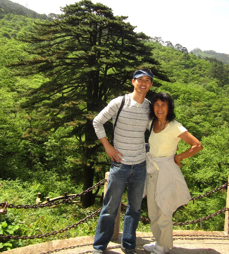 Me and my mom by a popular tree in the Huangshan Mountains.