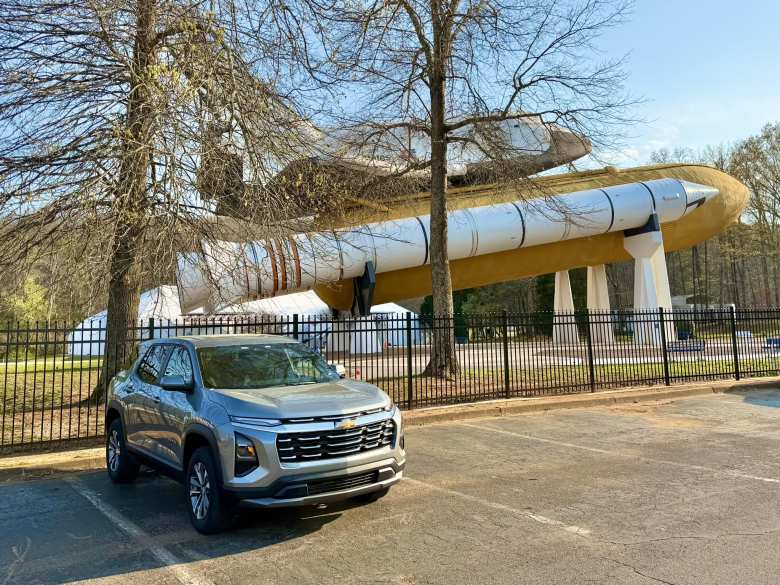 My Chevrolet Equinox rental car in front of the Space Shuttle Pathfinder wood-and-steel mockup at the U.S. Space & Rocket Center in Huntsville, Alabama.