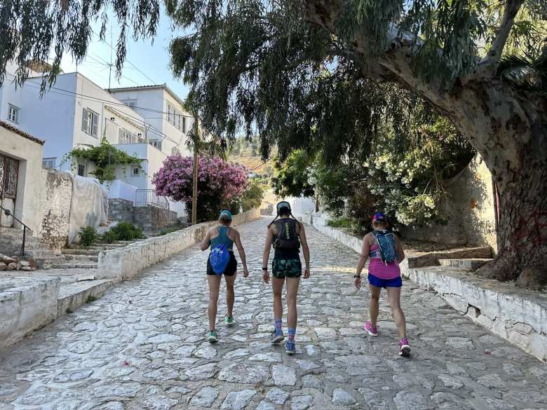 Kate, Becca, and Mel walking up a cobblestone path on our 20-kilometer hike to the monastery and the highest point on Hydra.