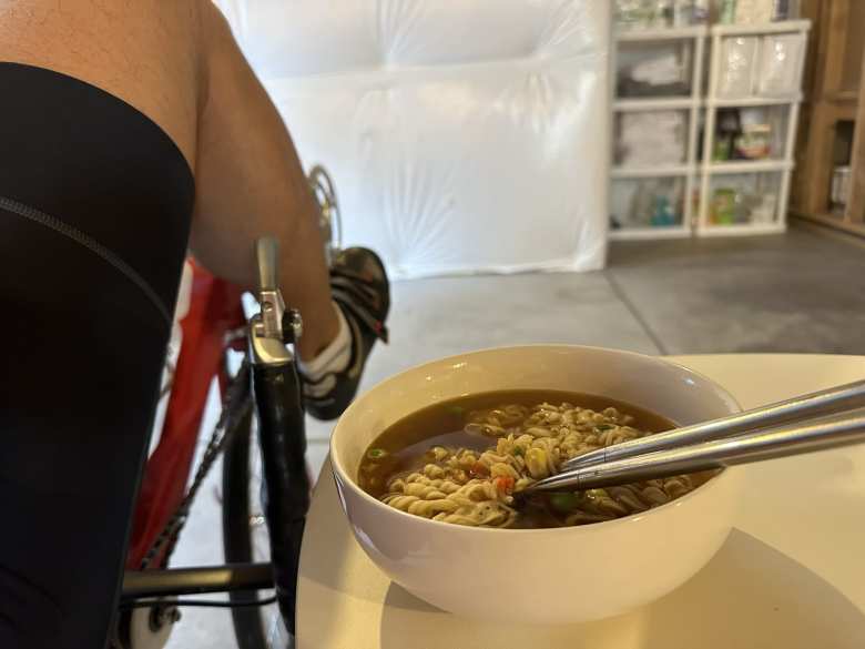 Eating ramen while biking on the stationary recumbent.