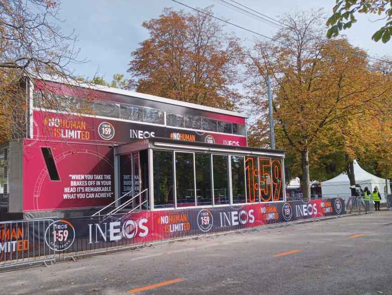 A small building at Prater Park adorned with INEOS logos and slogans.