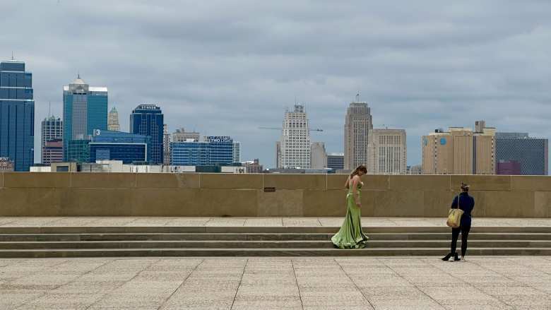 A photo shoot at the National WWI Museum and Memorial with the Kansas City skyline in the backdrop.