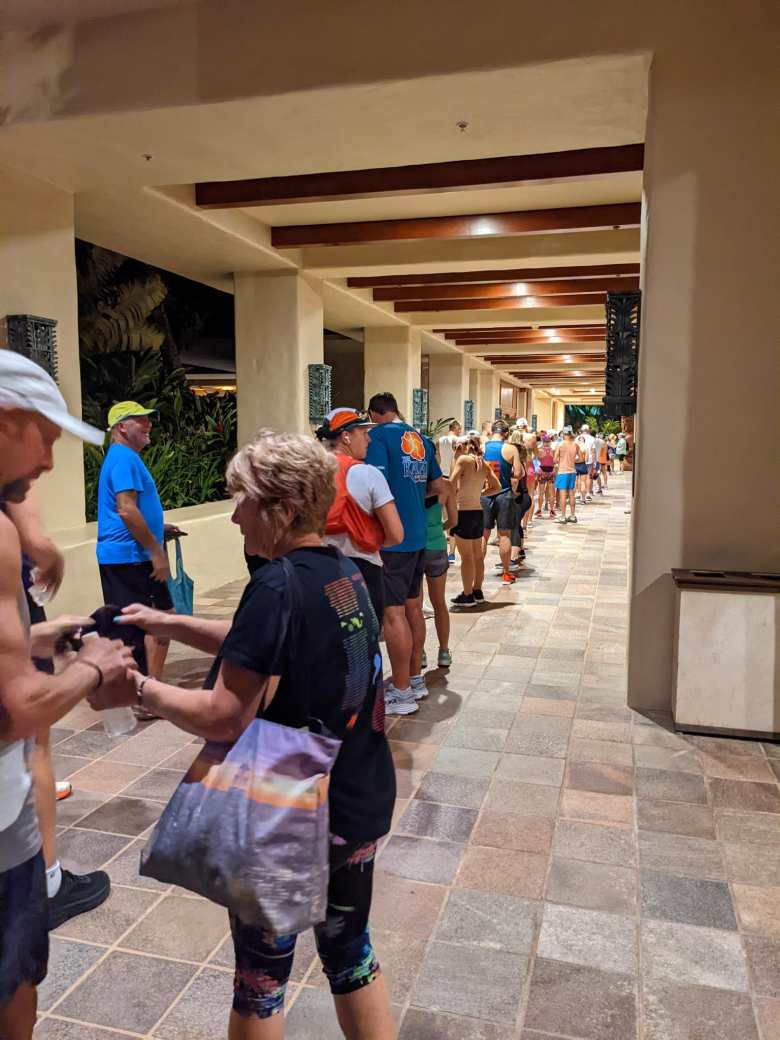 A long queue for a shuttle bus from the Grand Hyatt to the race start.