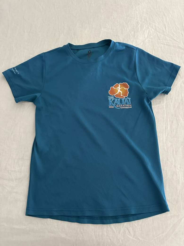The technical T-shirt given to participants of the 2022 Kauai Marathon. 