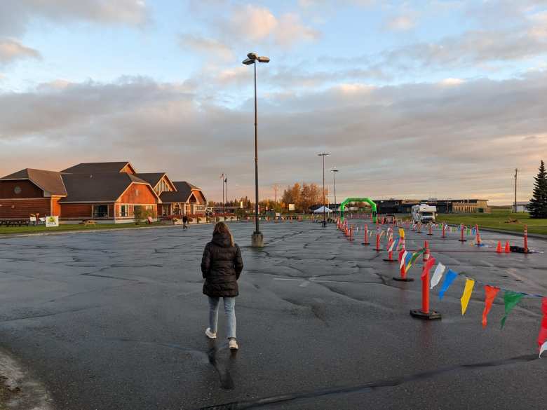 Andrea walking to the Kenai Visitors & Cultural Center, the start and finish of the 2022 Kenai River Marathon.